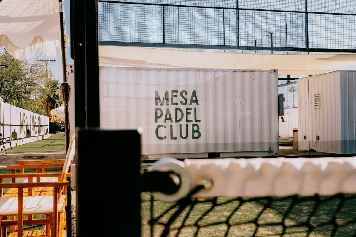 The shaded seating area beside the courts at Mesa Padel Club.